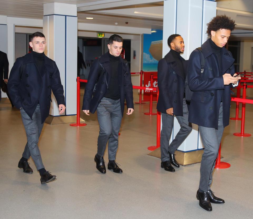  Man City's stars made their way through their airport as they prepare for their final group stage game