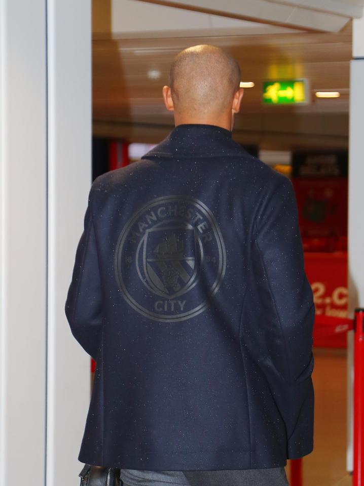  The jackets show off the Manchester City club crest on the back, en route to Champions League away-day