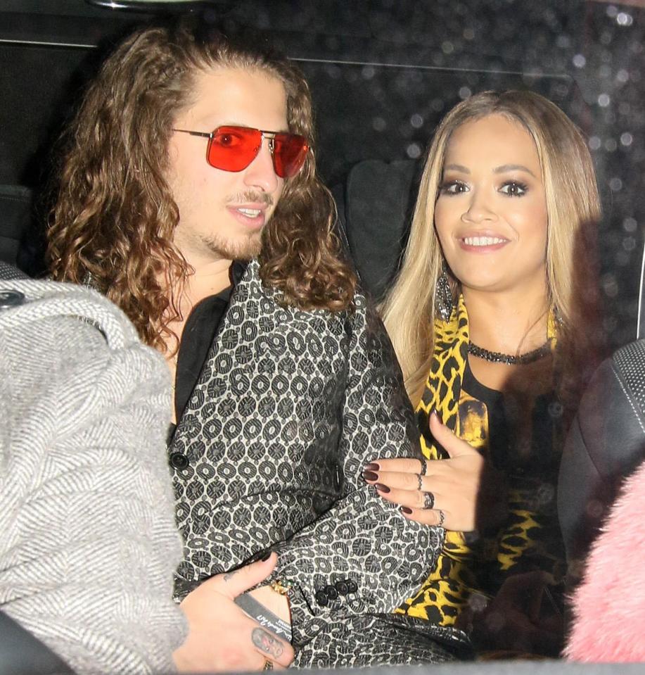  Rita changed into a bold yellow and black suit later in the evening and was seen with boyfriend Andrew Watt