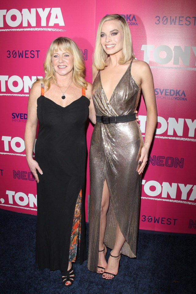 Margot posed next to Tonya Harding at the event