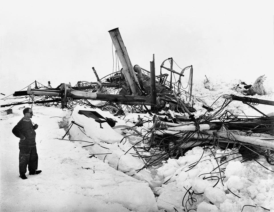  A crew member surveys the wreckage of the Endurance after it was crushed by Antarctic ice