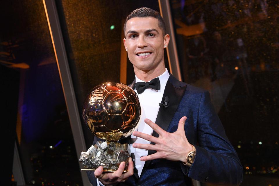  Cristiano Ronaldo poses with his fifth Ballon d'Or crown