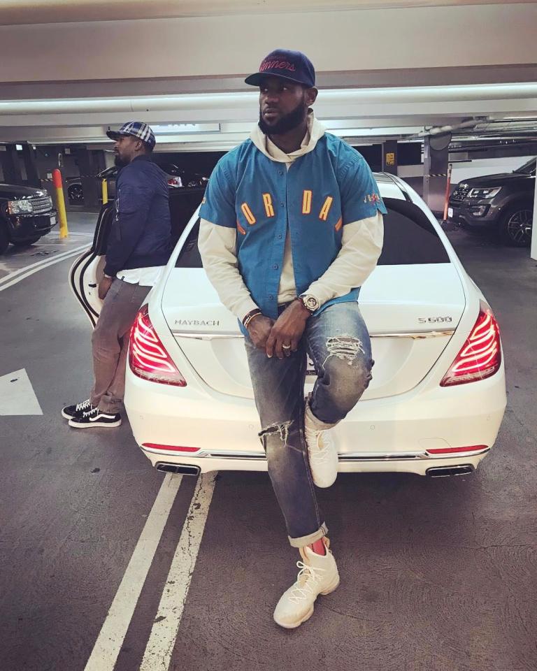  LeBron James leans against his Mercedes Maybach