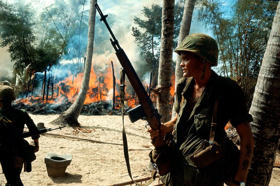  US soldiers and marines burn down jungle villages if they suspected they were harbouring the Viet Cong insurgents