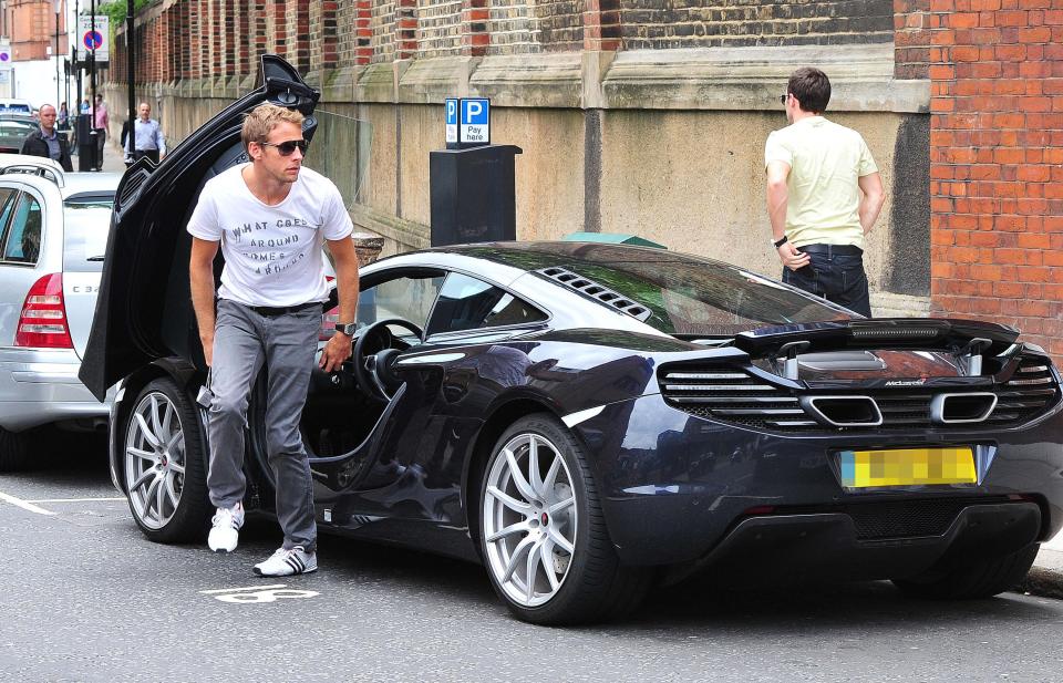  Jenson Button steps out of his McLaren P1, which set him back over £1m