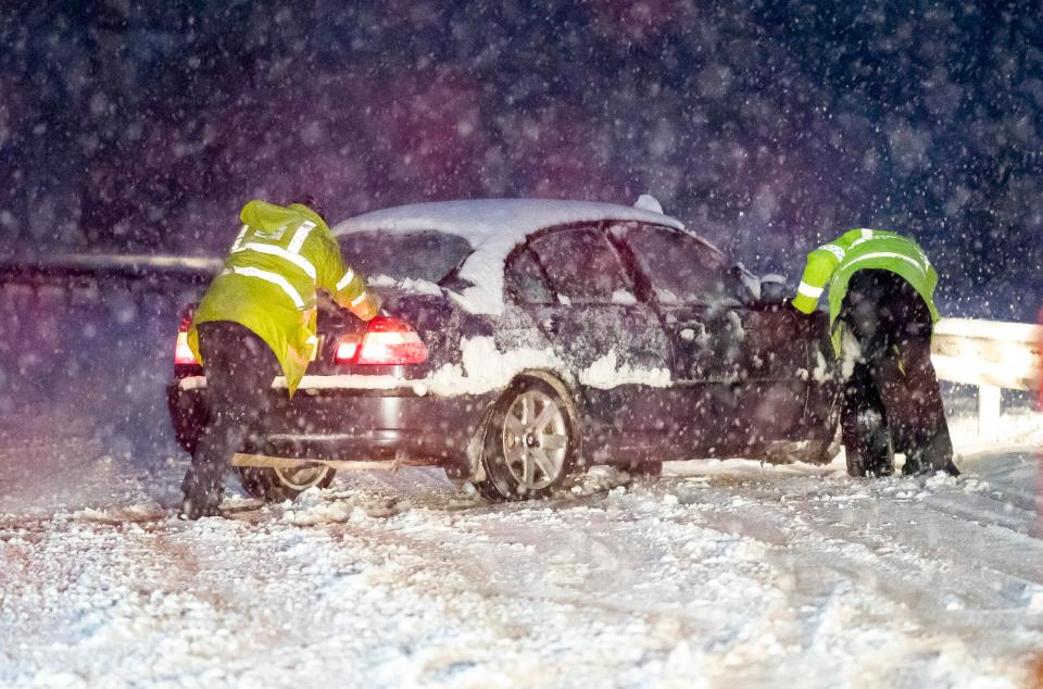  Police officers attempt to rescue a car in Bourne End, Buckinghamshire