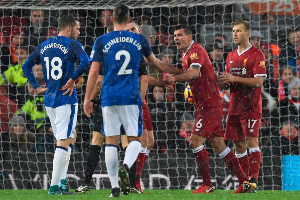  Dejan Lovren and Jordan Henderson argued with the referee moments after Everton were awarded the penalty