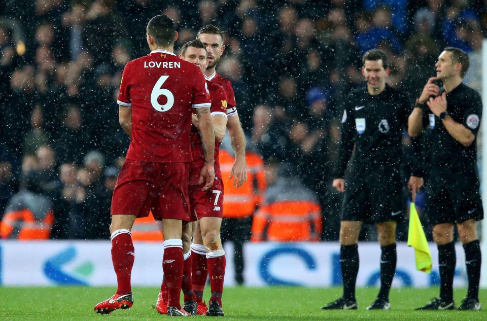  James Milner and Jordan Henderson push Dejan Lovren away from the referee following the final whistle