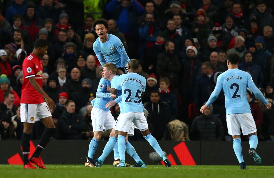  Manchester City players celebrate as they beat Manchester United 2-1