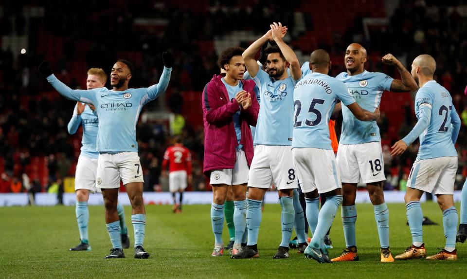  The Manchester City players wildly celebrated on the pitch after winning 2-1 at Old Trafford