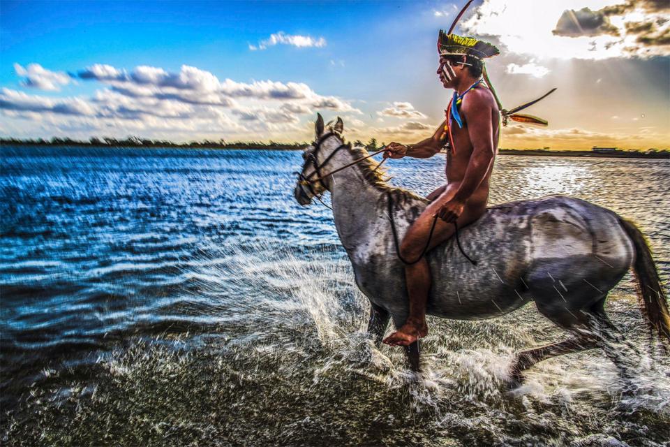  Ricardo Stuckert's incredible pictures included this one of  aTanawy Xucuru Kariri tribesman riding his horse in the São Francisco river