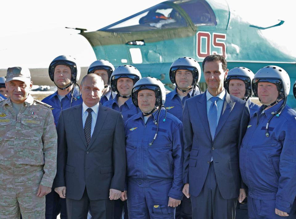  The two leaders posed with Russian pilots who are flying in support of regime forces