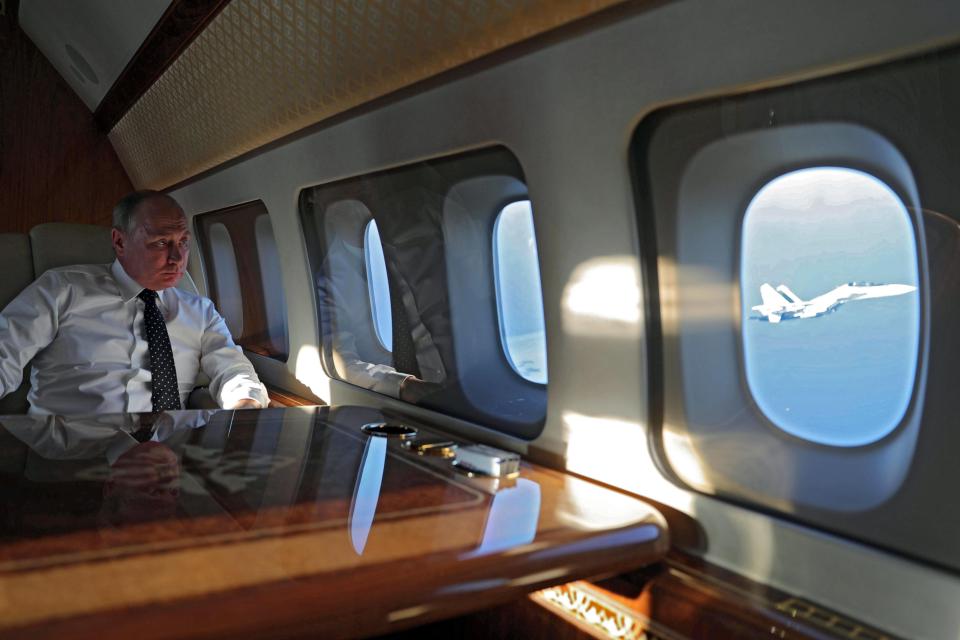  Russian President Vladimir Putin is escorted by a Russian fighter jet on his way to Syria earlier this week