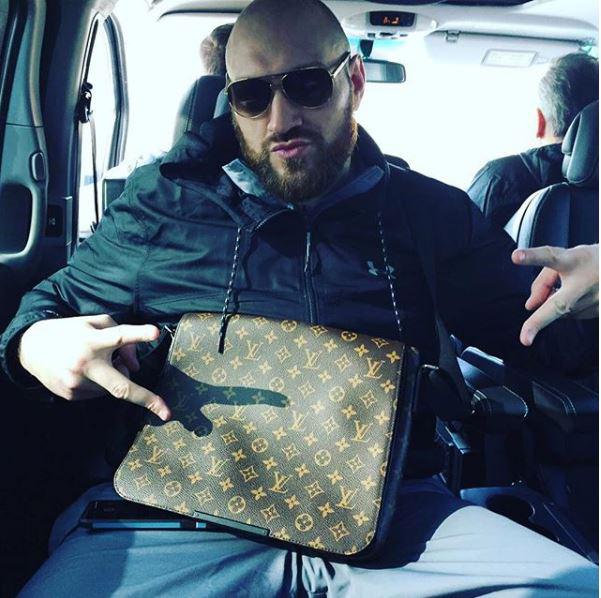  Tyson Fury shows his love for his expensive designer man-bag from Louis Vuitton