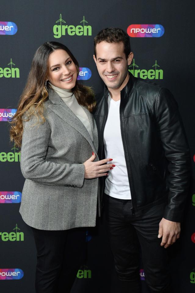  Kelly Brook poses with boyfriend Jeremy Parisi outside the venue where Blue played