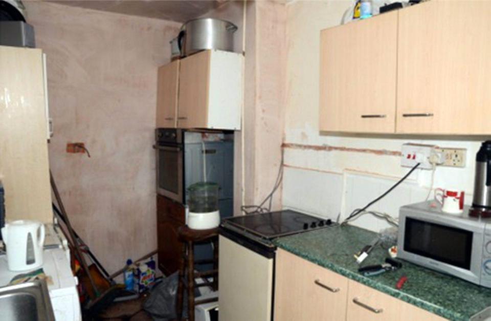  Four men were forced to live in a Derby house with dangerous wiring and mould on the walls