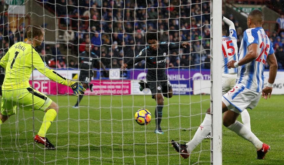  Willian headed home from close range to make it two after meeting Marcos Alonso's cross