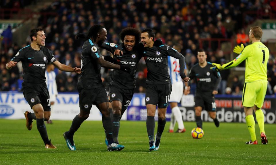  Chelsea stars mob Pedro after he stretched their lead to three