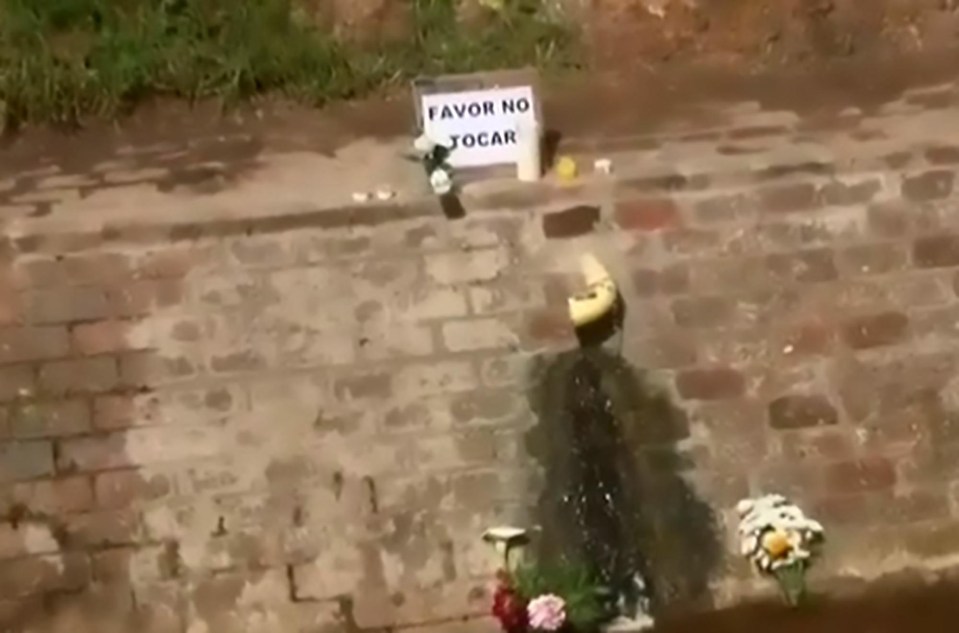 Devout Catholics left flowers and a sign asking others not to touch it