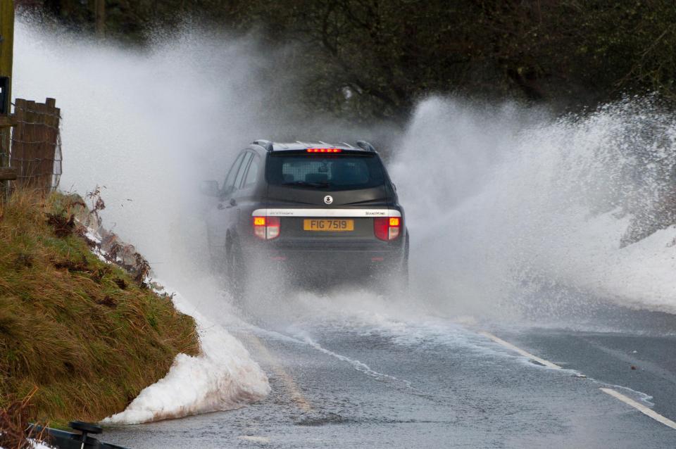  Heavy rainfall and melting snow left huge puddles today near Brecon, Wales