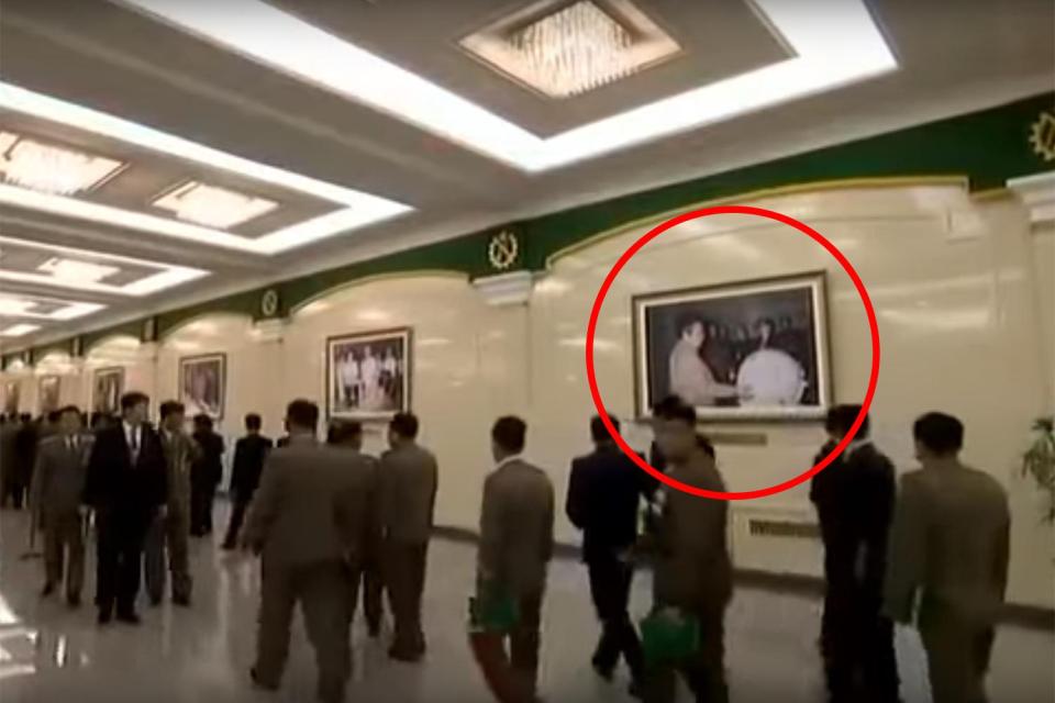  A picture caught in the background of state propaganda appears to show late leader Kim Jong-il inspecting what could be a nuclear bomb