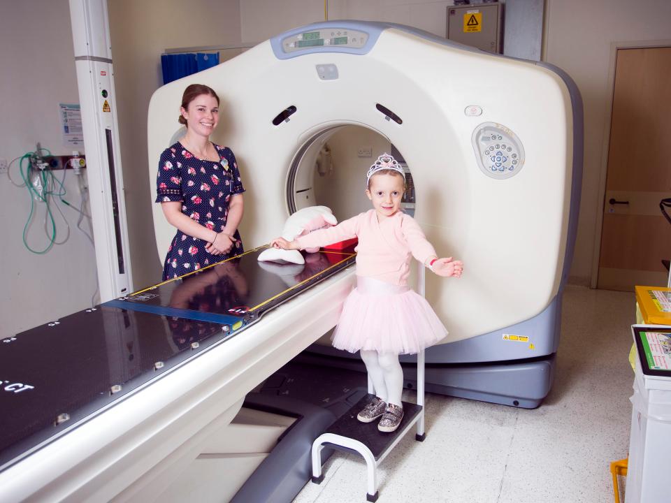  Play specialist Laura showed Imogen how the pink dolphin was brave enough to do a CT scan so that Imogen wouldn't be scared