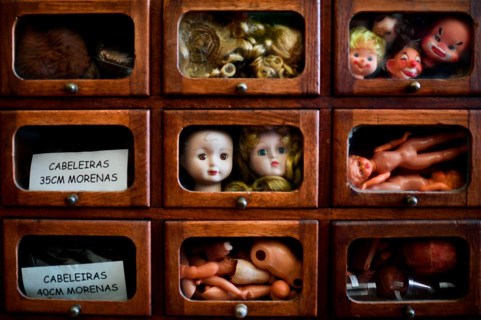  Spare parts are displayed in old-fashioned wooden cabinets at Lisbon's doll hospital