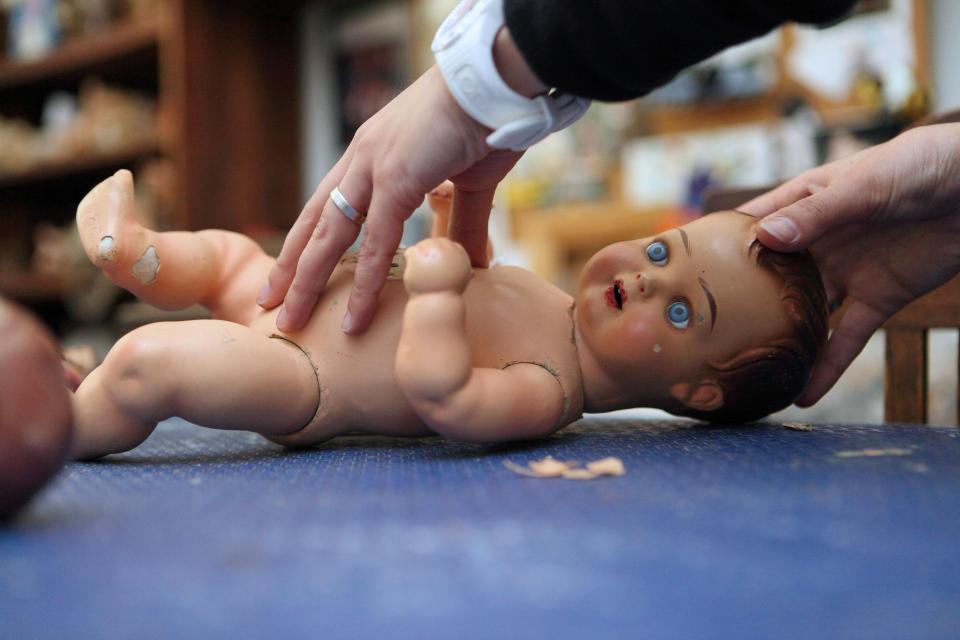  Chipped and battered dolls are treated with almost as much care as human patients