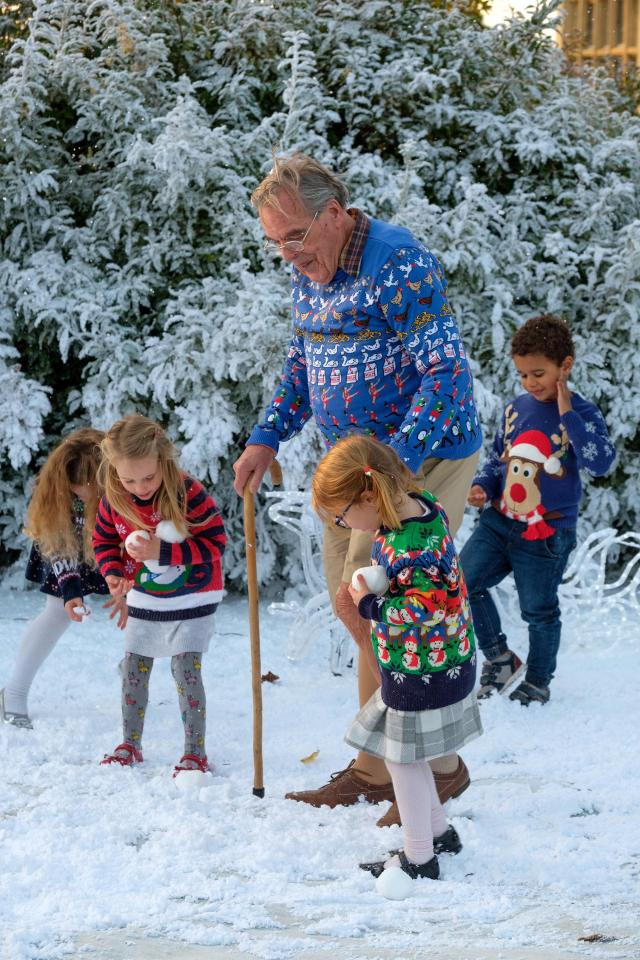  Resident Hamish plays in the snow with some of the kids