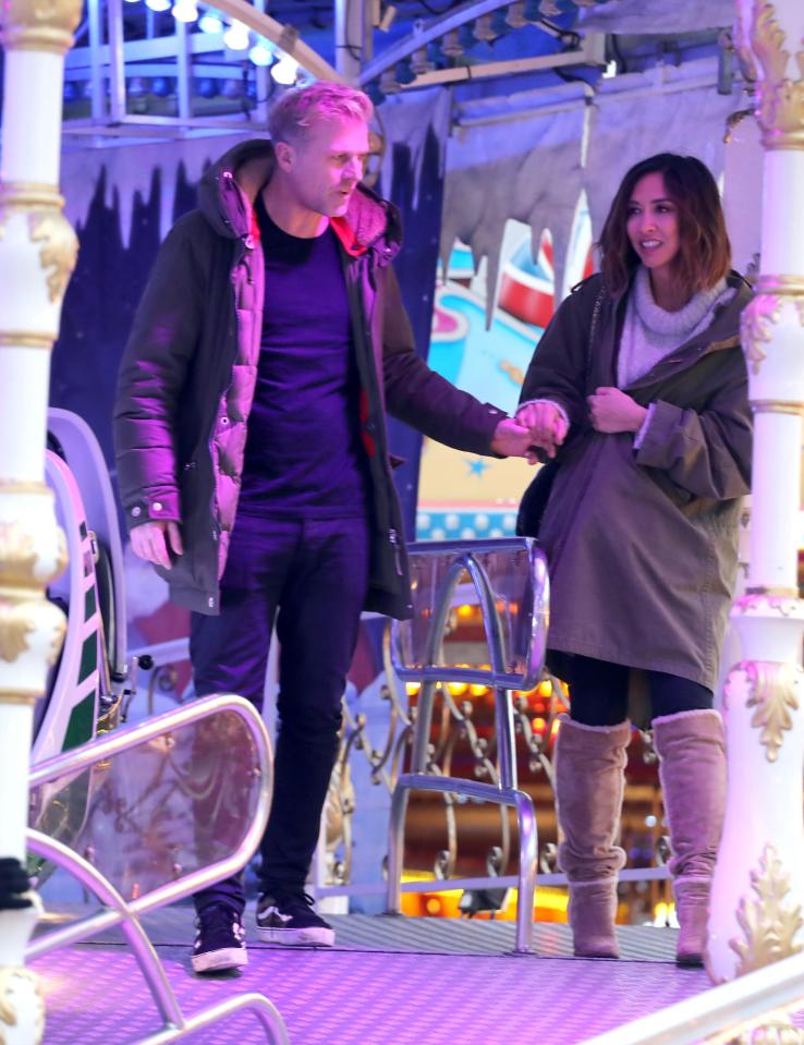  The pair got close and held hands around at Winter Wonderland