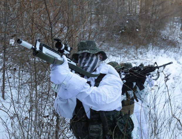 North Korean Hackers could disrupt the Winter Games taking place in the South next year. Pictured: South Korean marines during a training exercise