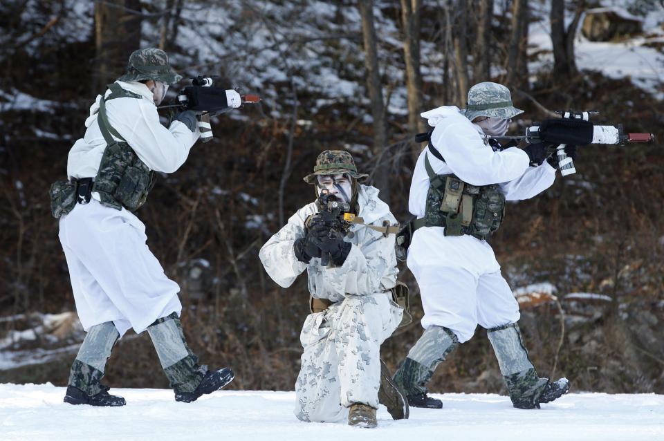  Experts say North Korea will want to belittle the South's image on the world stage. Pictured: South Korean marines