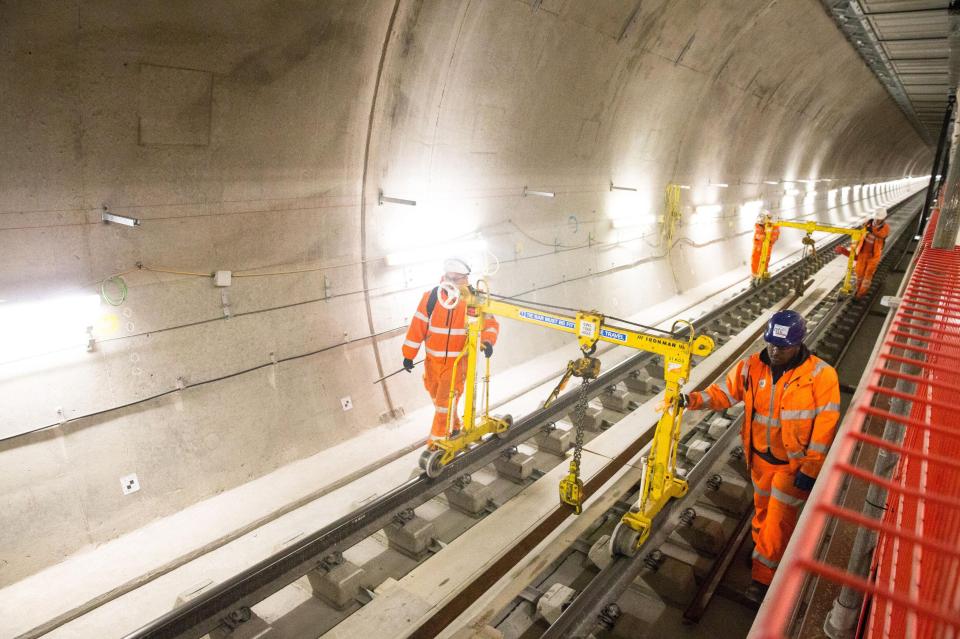  Engineers can be seen working on track at Farringdon station in central London ahead of the opening of the new Elizabeth line next year