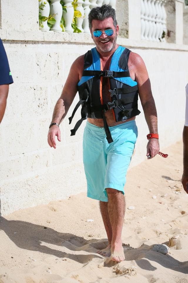  Simon looks chirpy as he walks along showing off his tan