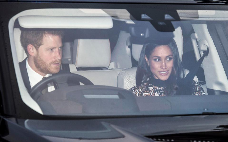  Meghan smiled beside her fiance Prince Harry as they arrived for the family Christmas lunch yesterday