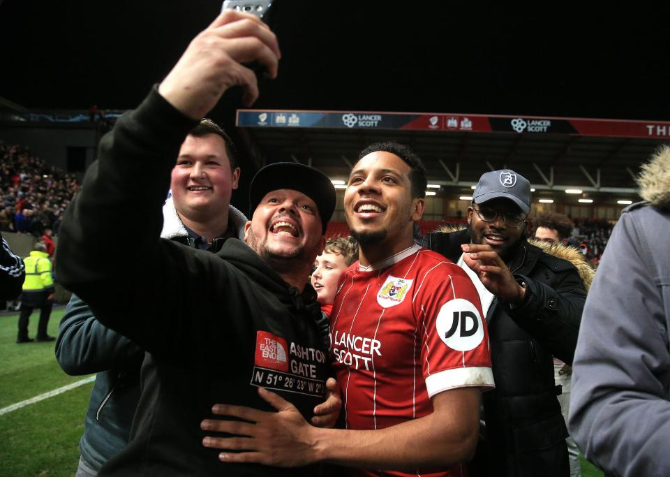  Bristol City hero Korey Smith takes selfies with pitch-invading fans