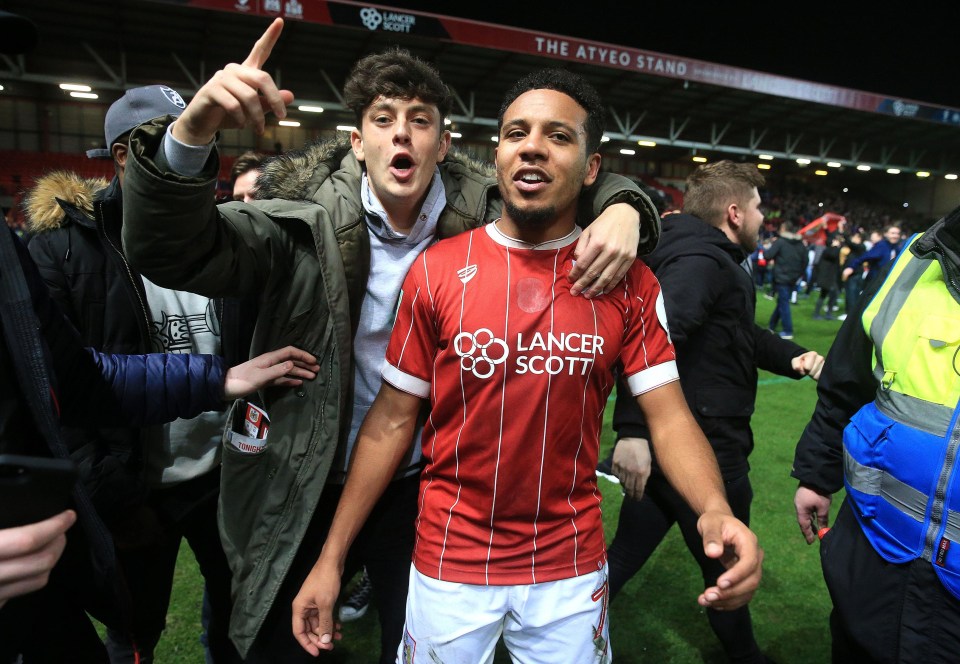 Korey Smith stays on the pitch to celebrate with Bristol City supporters