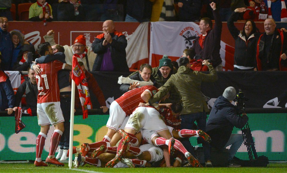 Bristol City stars run to the corner to celebrate after Korey Smith's late winner