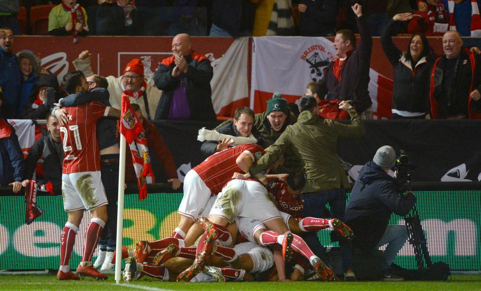  Bristol City stars run to the corner to celebrate after Korey Smith's late winner