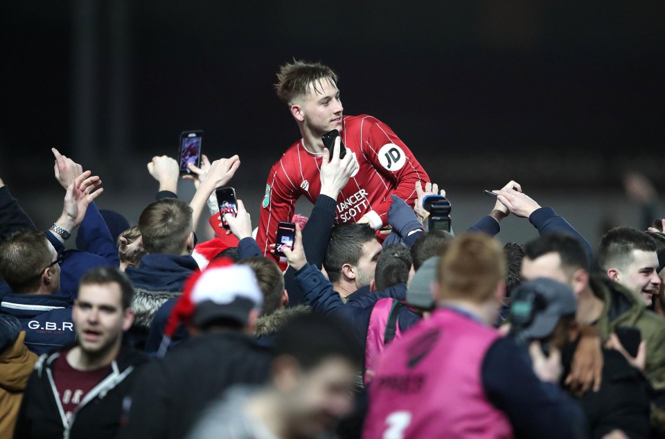 Josh Brownhill is hoisted into the air by Bristol City supporters