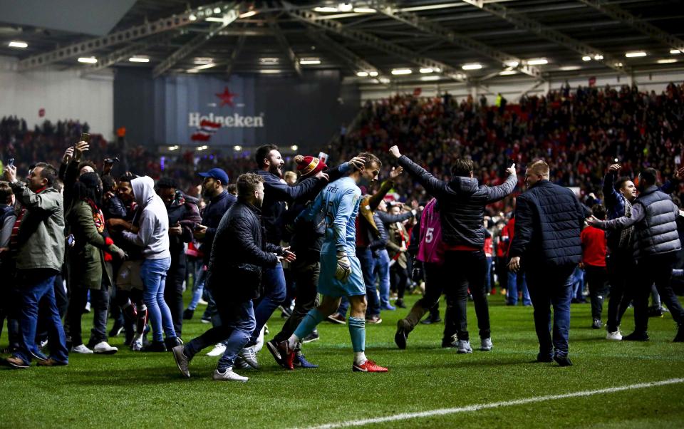  Bristol City fans flock onto pitch to celebrate famous win over Manchester United