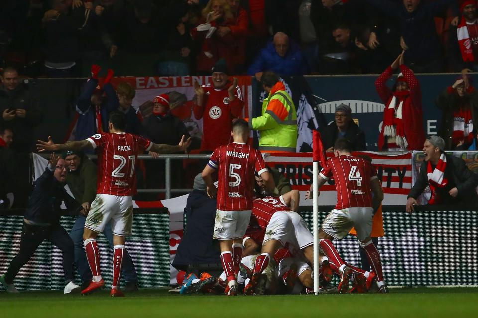  Korey Smith celebrates with team-mates after last gasp goal at Ashton Gate