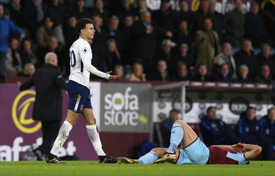  Dele Alli reacts after colliding with Charlie Taylor