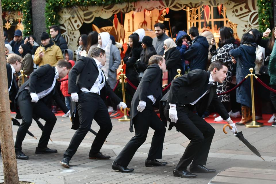  Queuing shoppers were treated to entertainment as they made their way inside Harrods today