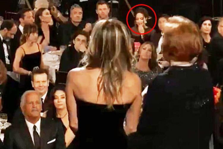  The shot of Dakota giving Angelina the side-eye while Jennifer Aniston was on stage went viral