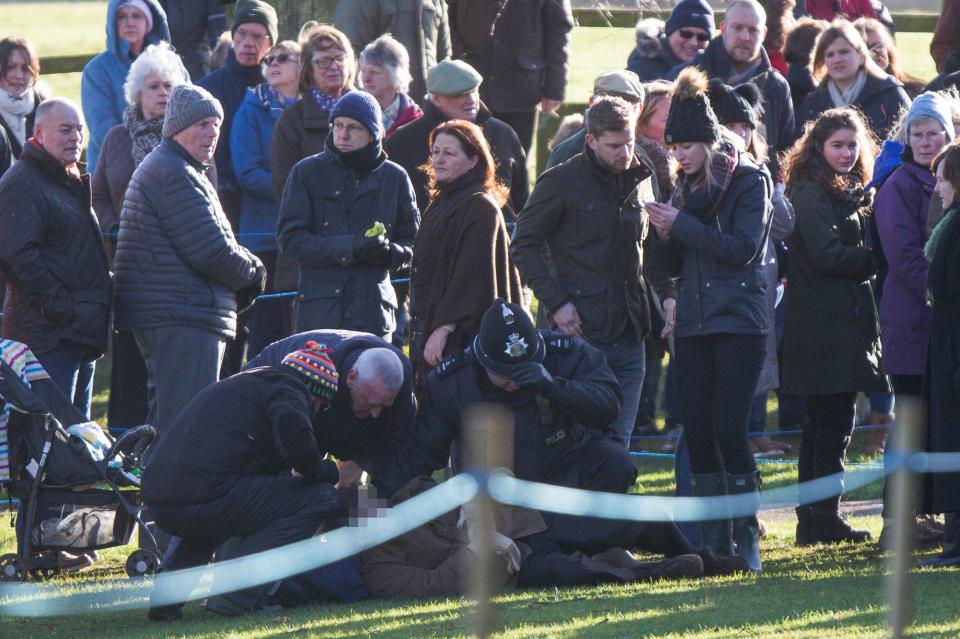  This is the dramatic moment a man collapsed yards from Prince William and Kate Middleton as they walked back from their Sandringham church service