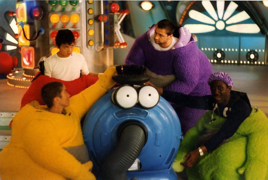  The Teletubbies actors in costume on the brightly coloured set