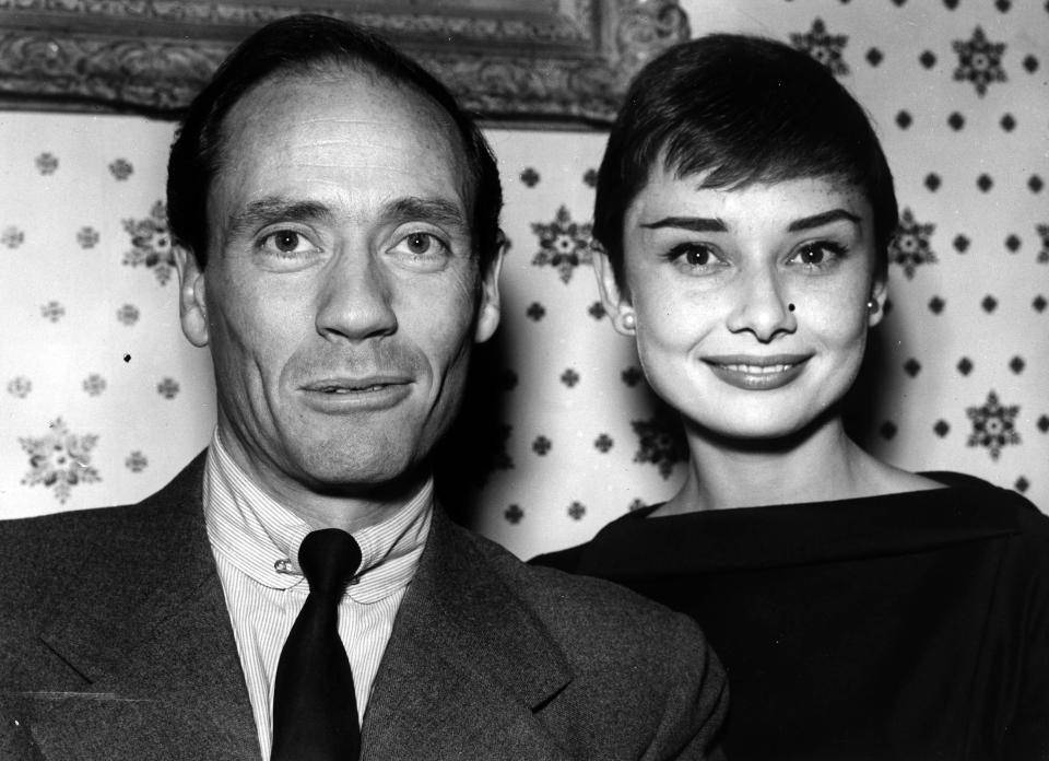  1954: Audrey is pictured with her husband Mel Ferrer during a press reception at the Dorchester hotel. Her minimal eye make-up and strong eyebrows suit her delicate features