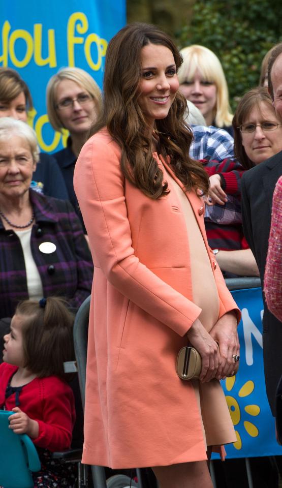  Kate made sure all eyes were on her in an orange Tara Jarmon coat