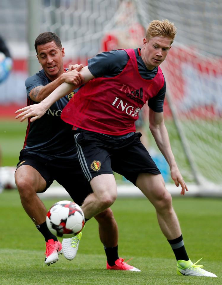  De Bruyne and Eden Hazard vie for the ball during international training